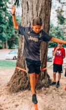 child walking on a rope