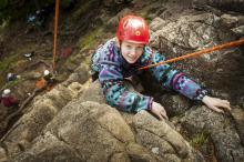 woman rock climbing