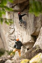 people rock climbing