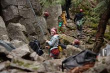 people rock climbing together