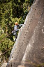 person rock climbing