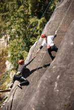 people rock climbing